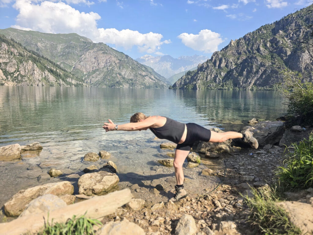 Yoga pose on a rock in Sary Chelek, Kyrgyzstan